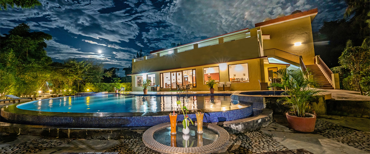 Exterior view of mud huts at Aura Corbett Resort