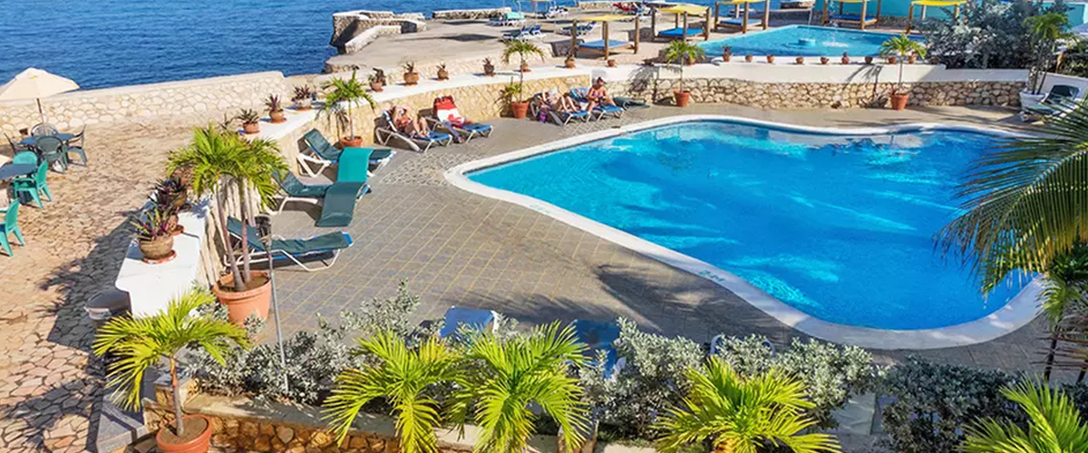 Infinity pool surrounded by forest at Samsara Resort